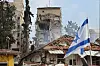 Israeli rescue teams work at the site of a damaged residential area after Iranian ballistic missiles hit Rehovot, central Israel, on June 15. [EPA/YONHAP]