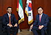 The U.A.E. Ambassador to Korea Abdulla Saif Al Nuaimi, left, and the People Power Party Rep. Lee Myoung-su, right, who heads the Korea-U.A.E. parliamentary association, discuss latest events in the U.A.E-Korea ties at the embassy in Seoul on Sept. 10. [PARK SANG-MOON]
