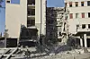 A soldier runs in front of the damaged Syrian Defense Ministry building allegedly hit by several Israeli airstrikes, in Damascus, Syria, July 16. [AP/YONHAP]