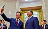 President Lee Jae Myung, left, takes a selfie Chinese President Xi Jinping using a Xiaomi smartphone during a state dinner at the Great Hall of the People in Beijing after their bilateral summit on Jan. 5. [JOINT PRESS CORPS]
