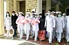 Nurses carry triplets born in Pyongyang in this photo released by the Rodong Sinmun on Jan. 12. [NEWS1]