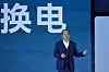 Robin Zeng, the CEO of China-based CATL battery manufacturing company, speaks near the words reads ″swap battery″ at a launch event for the next generation of swap stations in Xiamen, Fujian province, China, on Dec. 18, 2024. [AP/YONHAP]