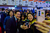 President Lee Jae Myung, left, takes selfies with graduates after a KAIST commencement ceremony at the school’s campus in Daejeon on Feb. 20. [JOINT PRESS CORPS]