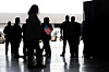 The first group of Afrikaners from South Africa to arrive for resettlement listen to remarks from U.S. government officials after they arrive at Washington Dulles International Airport in Dulles, Virginia, on May 12, 2025. [AFP/YONHAP]