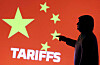 A 3-D printed miniature model depicting U.S. President Donald Trump, Chinese flag and word ″Tariffs″ in this illustration taken on April 17. [REUTERS/YONHAP]