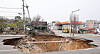 A massive sinkhole is seen near an intersection in Gangdong District in eastern Seoul on March 25. The sinkhole appeared a day before and injured one vehicle passenger and killed another motorcyclist. [NEWS1]