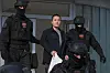 Montenegrin police officers escort Korean citizen Terraform Labs founder Do Kwon in Montenegro's capital, Podgorica, on March 23, 2024. [AP]
