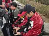 LG Twins fan Lee Chan-bok sits outside Jamsil Baseball Stadium in southern Seoul with his son on Oct. 26. [LEE YOUNG-KEUN]