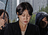 Moon Da-hye, the daughter of former President Moon Jae-in, appears for an investigation at Yonsan Police Station in central Seoul on Oct. 18 over an alleged drunk driving incident. [YONHAP]