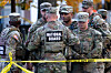 National Guard members stand together behind police tape, after two National Guard members were shot near the White House in Washington on Nov. 26. [REUTERS/YONHAP]
