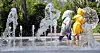 A child wearing a raincoat play at a fountain at Gwanghwamun Square in Jongno District, central Seoul, on May 20, as daytime temperatures across most parts of the country rose above 25 degrees Celsius, bringing early summer weather. [NEWS1]