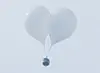 Balloons sent by North Korea carrying trash are spotted over Seoul on Monday. [YONHAP]