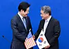 Lee Jae-myung, left, leader of the main opposition Democratic Party, shakes hands with acting U.S. Ambassador to South Korea Joseph Yun at the National Assembly on Jan. 22. [NEWS1]