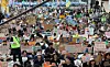 Participants hold signs calling for greenhouse gas reduction targets ahead of the Climate Justice March at Gwanghwamun Plaza in Jongno District, central Seoul, on Sept. 27. [YONHAP]