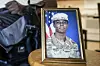 A portrait of American soldier Travis King is displayed as his grandfather, Carl Gates, talks about his grandson on July 19 in Kenosha, Wisconsin. [AP]