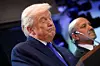 U.S. President Donald Trump, left, alongside Commerce Secretary Howard Lutnick, speaks about the Supreme Court striking down most of his tariffs during a press conference in the briefing room at the White House in Washington on Feb. 20. [EPA/YONHAP]