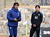 Yang Min-hyeok, right, chats with his head coach Hong Myung-bo before a training session at the National Football Center in Cheonan, South Chungcheong, on Nov. 11, 2025. [YONHAP]