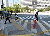Police officers clean up the scene where a YouTuber was killed after being stabbed by a fellow YouTuber on Thursday morning. [NEWS1]