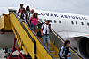 Repatriated Slovaks, Czechs, Austrians and Slovenians returning from Israel disembark from a flight from Amman, Jordan, after they left the region following a missile attack from Iran on Israel, at M. R. Stefanik Airport, in Bratislava, Slovakia, June 16. [REUTERS/YONHAP]