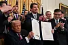 U.S. President Donald Trump holds the signed ″Genius Act″, which will develop regulatory framework for stablecoin cryptocurrencies and expand oversight of the industry, at the White House in Washington, D.C., U.S., July 18, 2025. [REUTERS/ YONHAP]