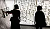 Citizens watch a multimedia video artwork about the creation of Hangul at ″The Story of King Sejong″ exhibition in Gwanghwamun, central Seoul, on Oct. 8. [NEWS1]
