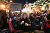 Protesters chant and bang on trash cans as they stand behind a makeshift barricade during a protest in response to the death of Alex Pretti, who was fatally shot by a U.S. Border Patrol officer earlier in the day on Jan. 24 in Minneapolis, Minnesota. [AP/YONHAP]