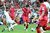 Korea's Lee Kang-in, center, dribbles the ball during a 2026 World Cup qualifer against Palestine at Seoul World Cup Stadium in western Seoul on Thursday. [YONHAP]