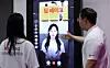 Models demonstrate LG Uplus’s AI anti-deepfake technology during an AI security technology briefing at the LG building in central Seoul on June 26, 2025. [NEWS1]