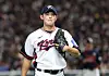 Korean reliever Kim Young-woo returns to the dugout after allowing a go-ahead run to Japan during the teams' exhibition baseball game at Tokyo Dome in Tokyo on Nov. 16, 2025. [YONHAP]