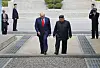 U.S. President Donald Trump and North Korean leader Kim Jong-un walk toward the South after greeting each other on the northern side of the military demarcation line at Panmunjom on June 30, 2019. [YONHAP]