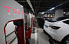 Tesla EVs are being charged at a Supercharger station in Seoul. [YONHAP]