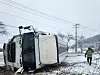 A truck lies on its side after sliding on an icy road in South Jeolla on Feb. 6. [YONHAP]