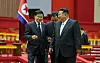 North Korean leader Kim Jong-un, right, smiles as he speaks with Lao President Thongloun Sisoulith on Oct. 7 during the latter's visit to Pyongyang. [RODONG SINMUN]