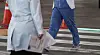 Doctors walk near a hospital in Daegu on Tuesday morning. [YONHAP]
