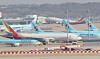 Korean Air Lines and Asiana Airlines aircraft parked at Incheon International Airport on Tuesday. [YONHAP]