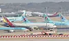 Korean Air Lines and Asiana Airlines aircraft parked at Incheon International Airport on Tuesday. [YONHAP]