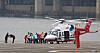 Democratic Party leader Lee Jae-myung being moved from an emergency helicopter to an ambulance at Nodeul Island, Yongsan, Seoul, on Jan. 2. On the far left, DP Rep. Cheon Jun-ho, who is the secretary to Lee, receives a greeting from an emergency respondent. [YONHAP]