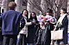 An international student takes photos with her friends during Hankuk University of Foreign Studies' graduation ceremony held at the university campus in Dongdaemun District, central Seoul, on Feb. 14, 2024. [YONHAP]
