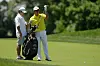 Hideki Matsuyama of Japan selects a club from his bag on the 13th hole during the final round of the Memorial Tournament presented by Workday at Muirfield Village Golf Club on Sunday in Dublin, Ohio. [GETTY IMAGES]