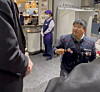 Lee Kim Chun-taek, a member of the Korean Metal Workers’ Union’s Geoje, Tongyeong and Goseong branch, is asked by a security guard to take off his union vest at a restaurant at Lotte Department Store's Jamsil branch in southern Seoul on Dec. 10 in this video uploaded to X, formerly Twitter. [SCREEN CAPTURE]