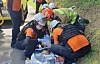Paramedics from the Gyeongsangnam-do Fire Department administer first aid to a suspect in his 50s, who injured himself, and a victim in cardiac arrest at a golf course in Geoje, South Gyeongsang, on Sept. 5.[GYEONGSANGNAM-DO FIRE DEPARTMENT]