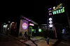A customer sits outside a cannabis shop in Kanchanaburi Province, west of Bangkok, Thailand, on July 16, 2024. [AP/YONHAP]