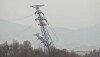 A transmission tower near the border north of the Gyeongui Line military demarcation line (MDL) falls on after wires are removed in this video released by the South's Unification Ministry on Tuesday. [MINISTRY OF UNIFICATION]