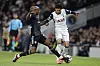 Tottenham's Son Heung-min, right, vies for the ball with Qarabag's Julio Romao during a Europa League match in London on Sept. 26. [AP/YONHAP]