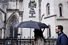 People walk past the Royal Courts of Justice in London on Aug. 28, 2025. [EPA/YONHAP]