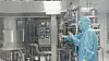 A researcher inspects anthrax vaccine manufacturing equipment at GC Biopharma Corp.'s vaccine production facility in Hwasun on July 1. [YONHAP]