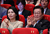 President Lee Jae Myung, right, and first lady Kim Hea Kyung smile as they attended the 30th Busan International Film Festival in Busan on Sept. 20. [YONHAP]