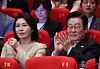 President Lee Jae Myung, right, and first lady Kim Hea Kyung smile as they attended the 30th Busan International Film Festival in Busan on Sept. 20. [YONHAP]