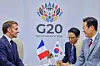 President Lee Jae Myung, right, speaks with French President Emmanuel Macron on the sidelines of the G20 summit at the Johannesburg Expo Centre in Johannesburg, South Africa, on Nov. 22, 2025. [JOINT PRESS CORPS]