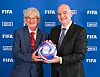 Homeless World Cup Co-Founder and President Mel Young, left, poses with FIFA President Gianni Infantino in Paris on Saturday. [FIFA]